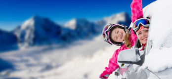 Winter holiday - happy family on the road for winter holidays